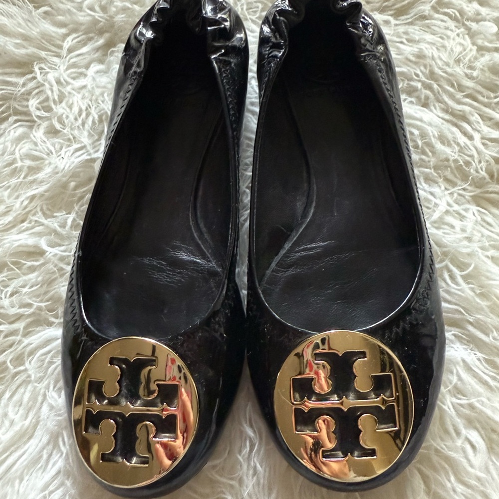 Tory Burch Black and Gold flats with logo